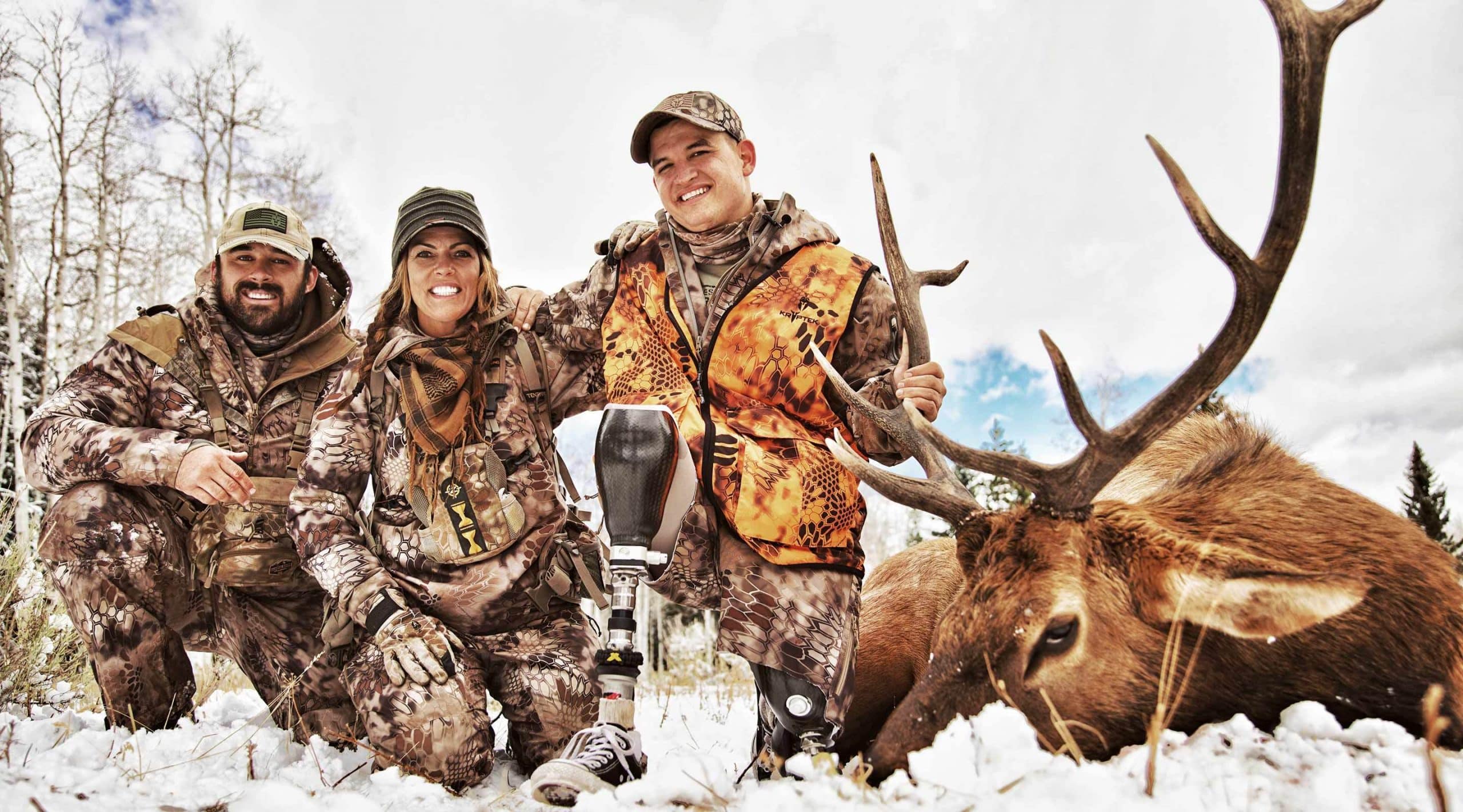 Jana Waller and friends with a late-season bull elk shot in the snow in Montana with former Navy SEAL Bo Reichenbach.