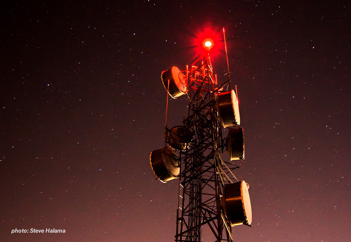 Cell tower with night sky background
