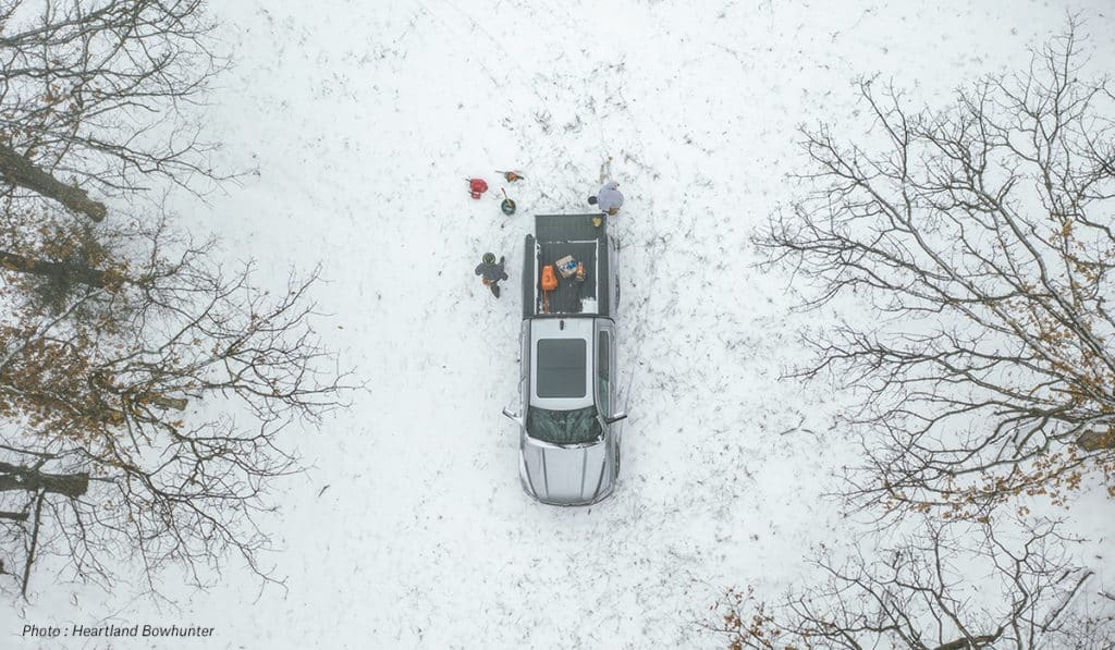 Aerial view of a hunting truck and two hunters.