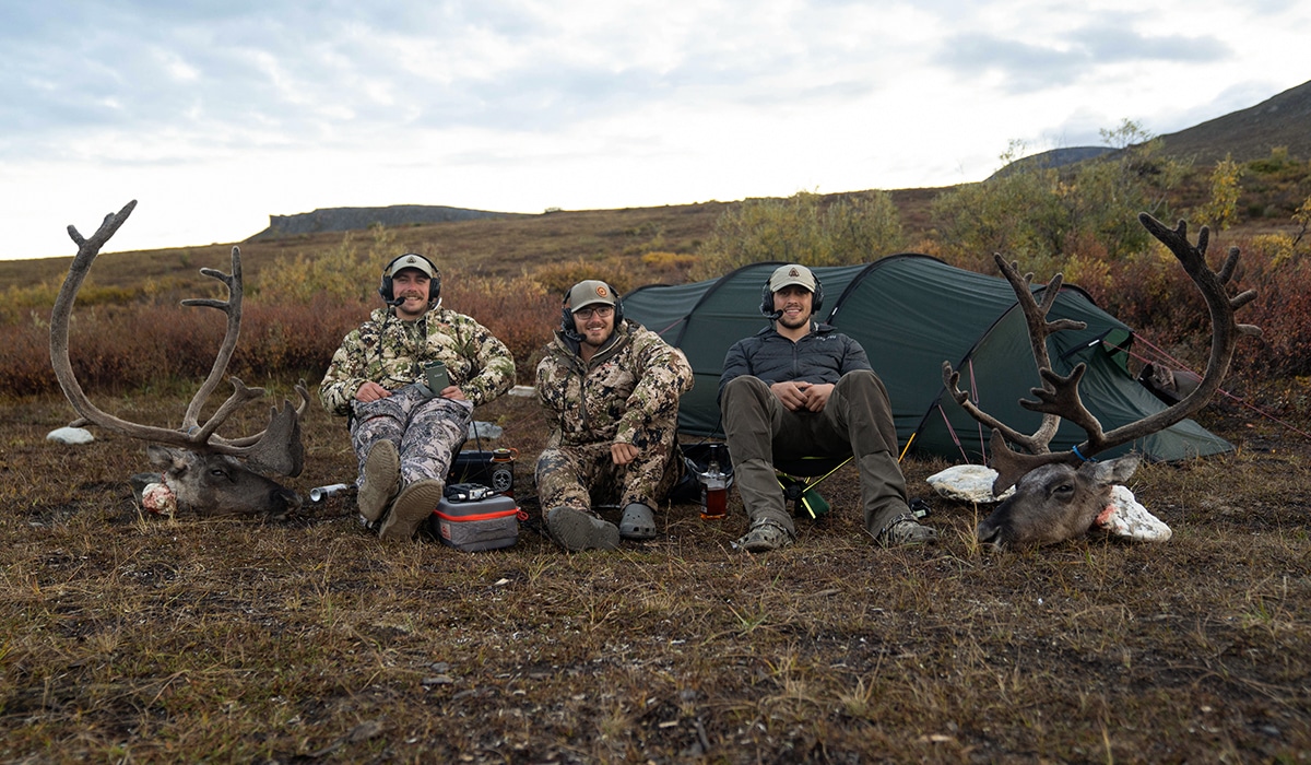 Happy hunters in camp after a successful Alaska caribou hunt.