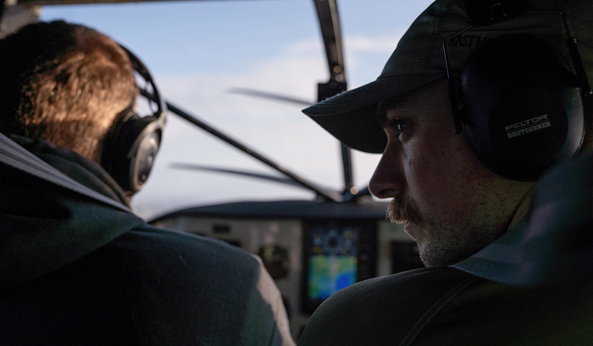 Two men in a bush plane heading to hunt Caribou in Alaska.