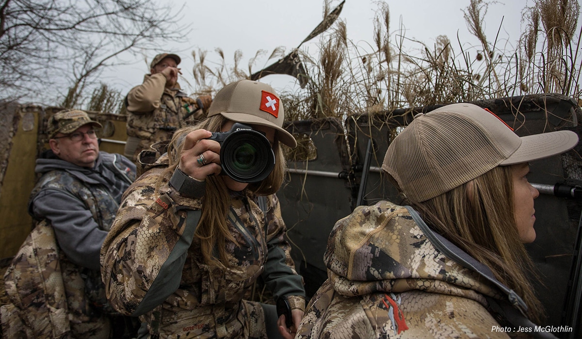 Female and male hunters in a goose blind in New Jersey.
