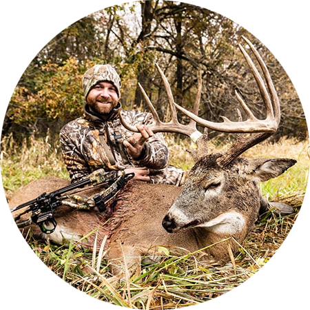 A bowhunter with the whitetail he harvested. 