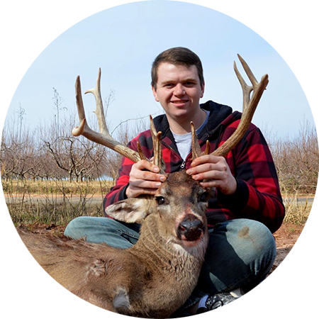 A whitetail hunter with the buck he harvested. 