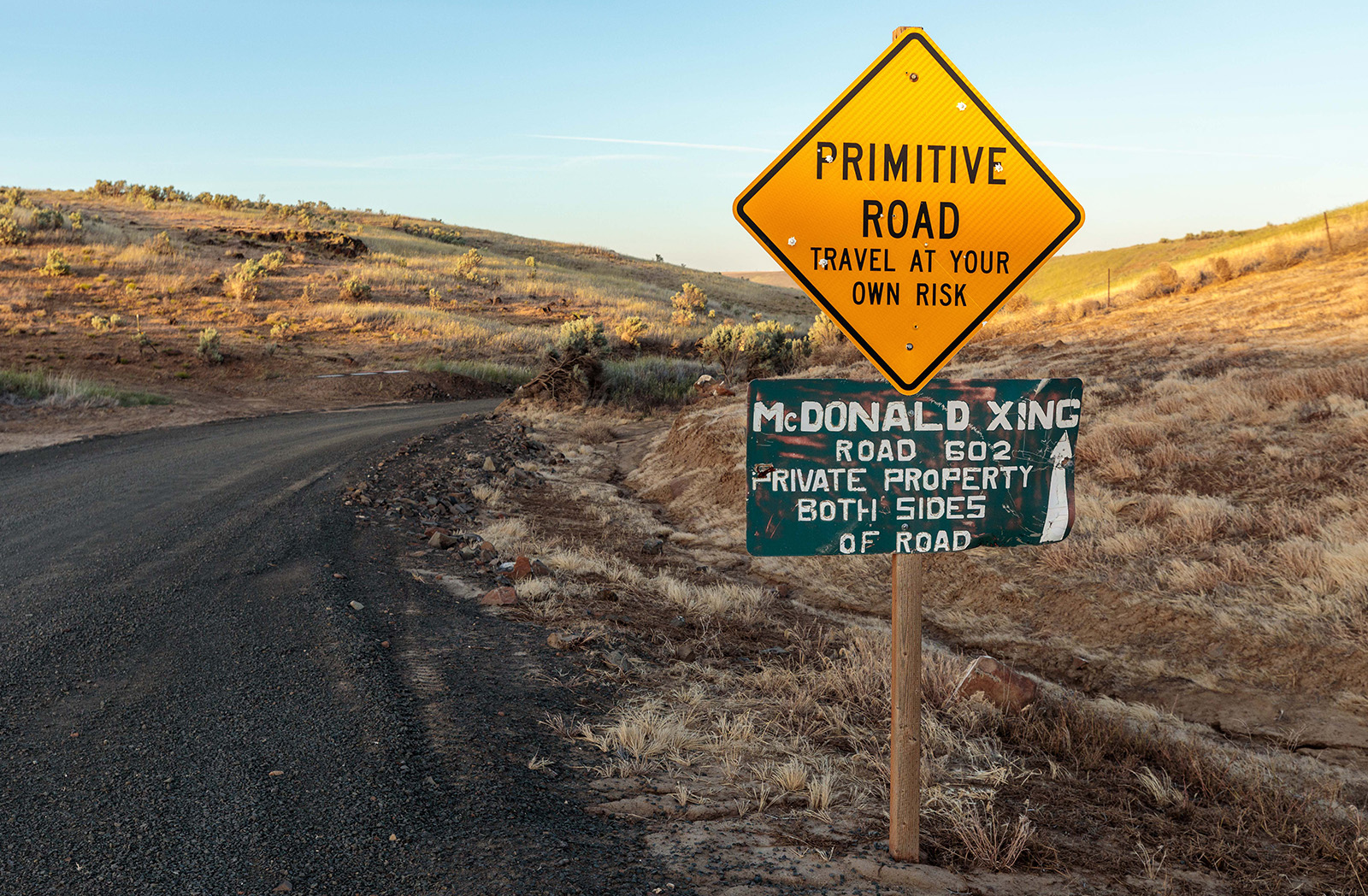 Road sign with McDonald Xing Private Property sign 