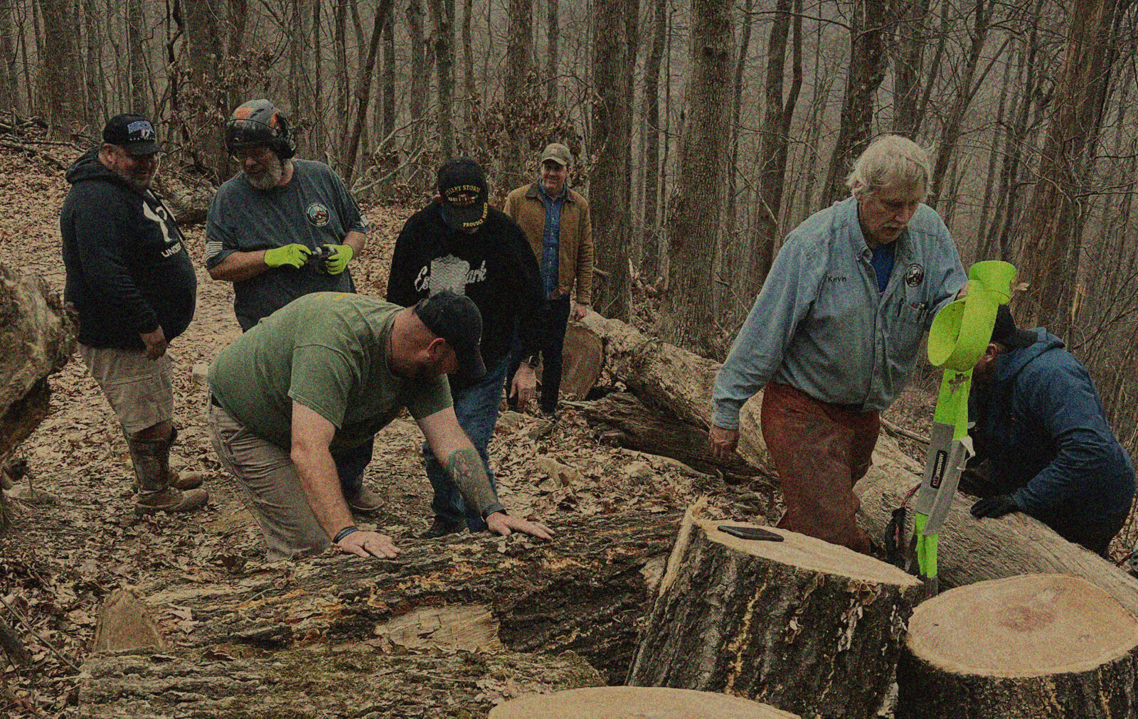 Volunteers working to clean up an offroad trail with toyota and onX offroad's trail revival project