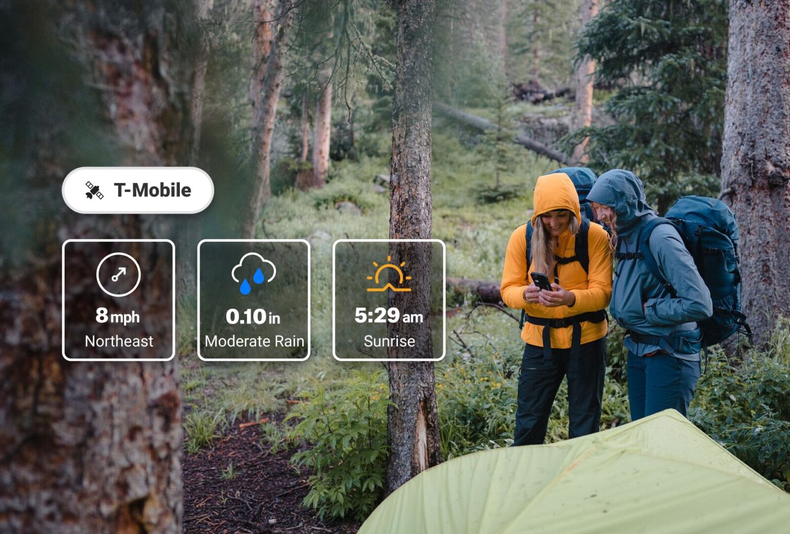 two hikers looking at the onx backcountry app