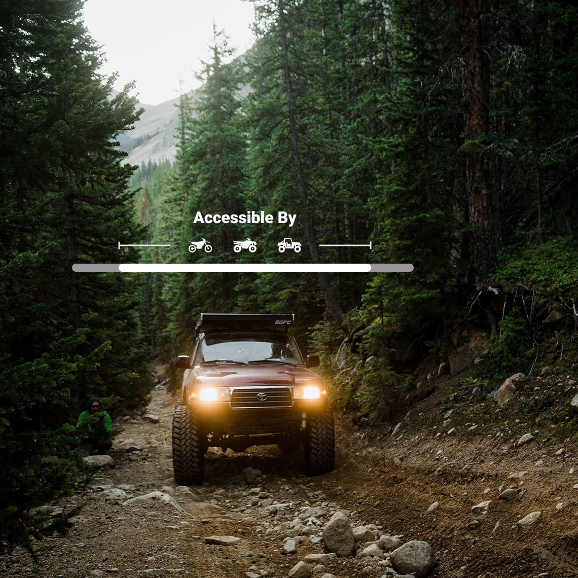 an off-road vehicle on a forested trail with the onX Offroad trail details of what ride type can take these trails