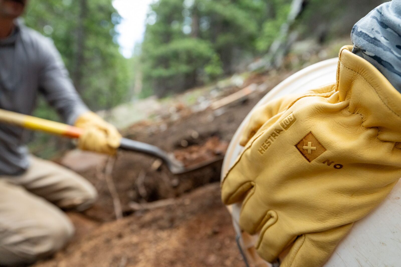 shoveling dirt to maintain trails