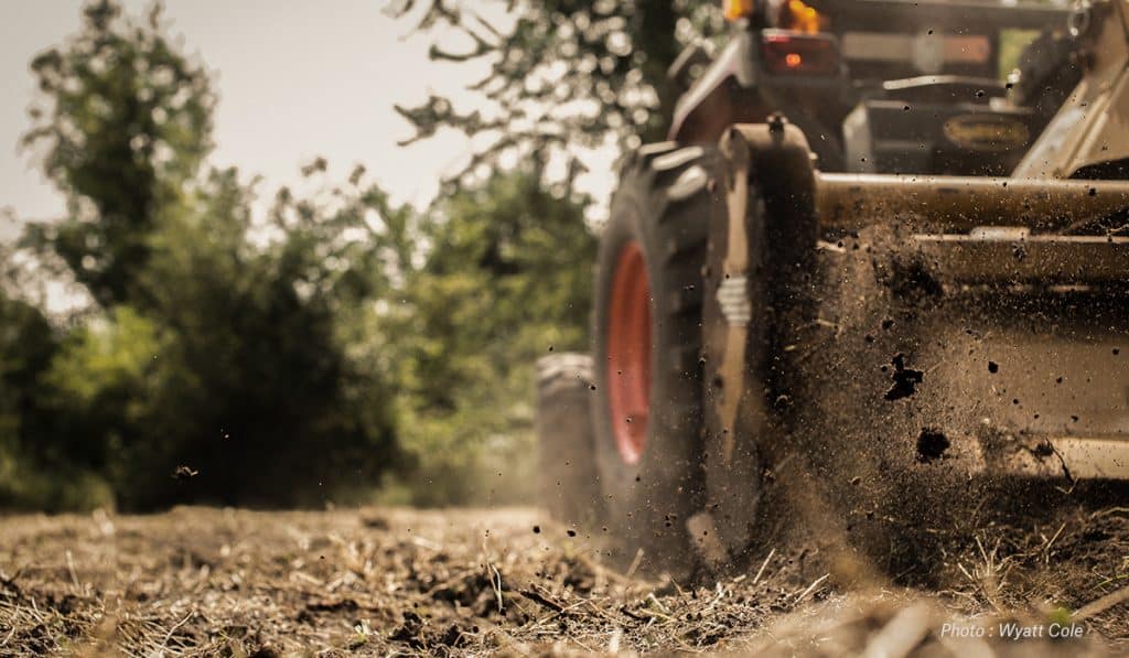 A tractor works a food plot. 