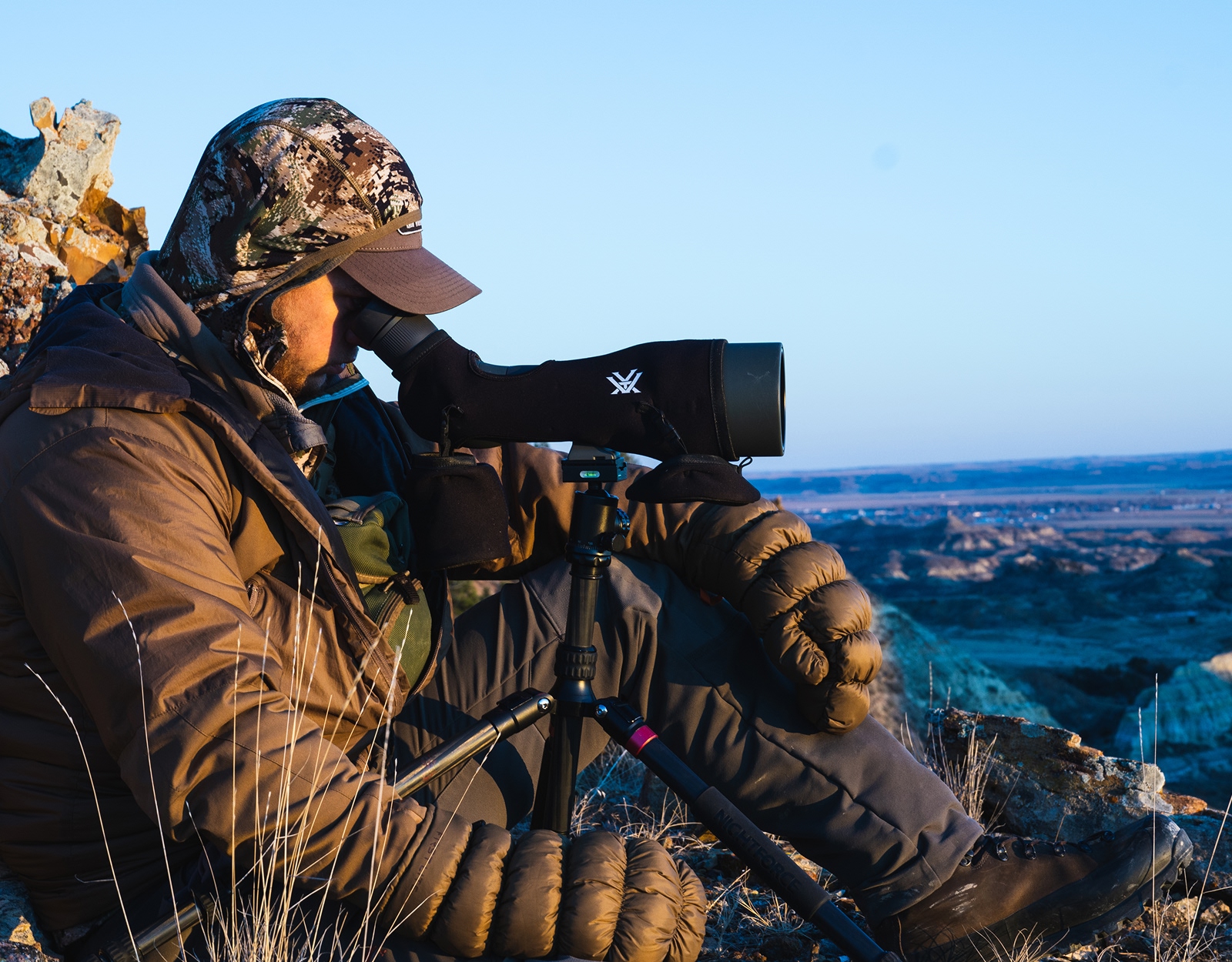 A hunter glassing with a spotter.