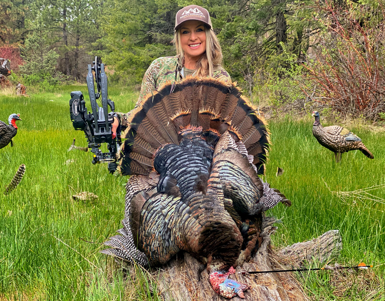 Woman bowhunter with the Rio Grande Wild Turkey she harvested. 