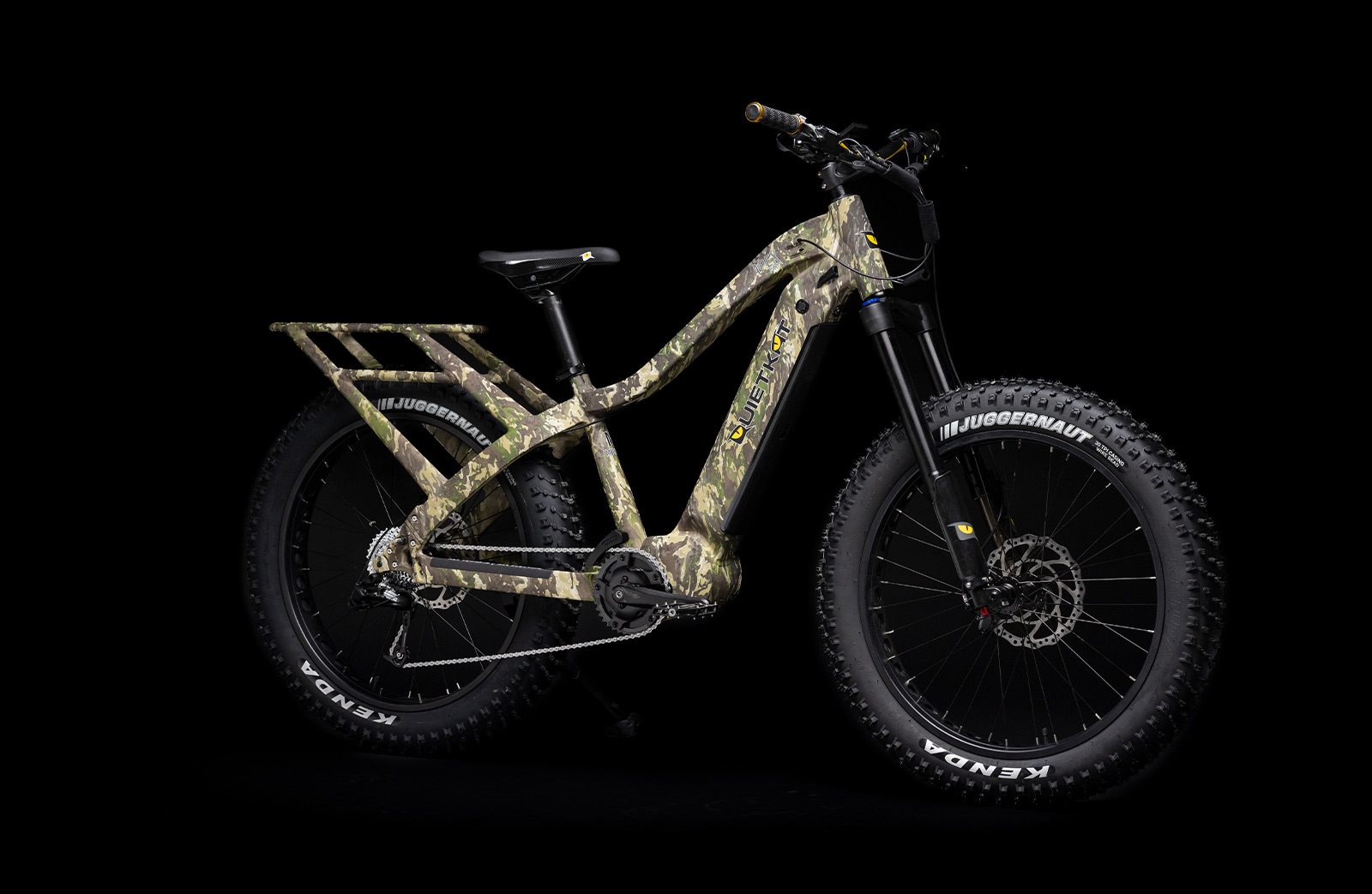 Quiet Kat camo colored e-bike for hunting on a black background
