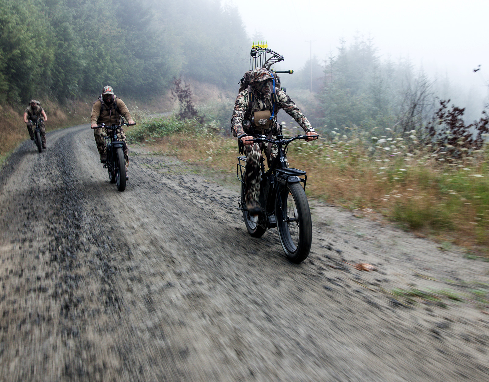 3 hunters shown riding their e-bikes for hunting through the trail 