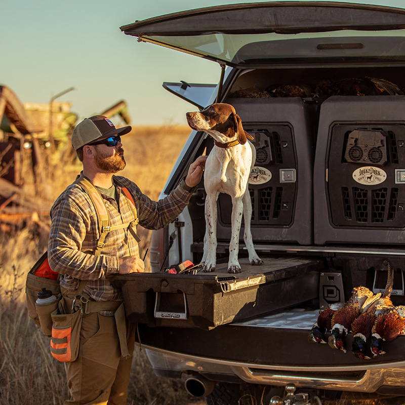 man with bird dog