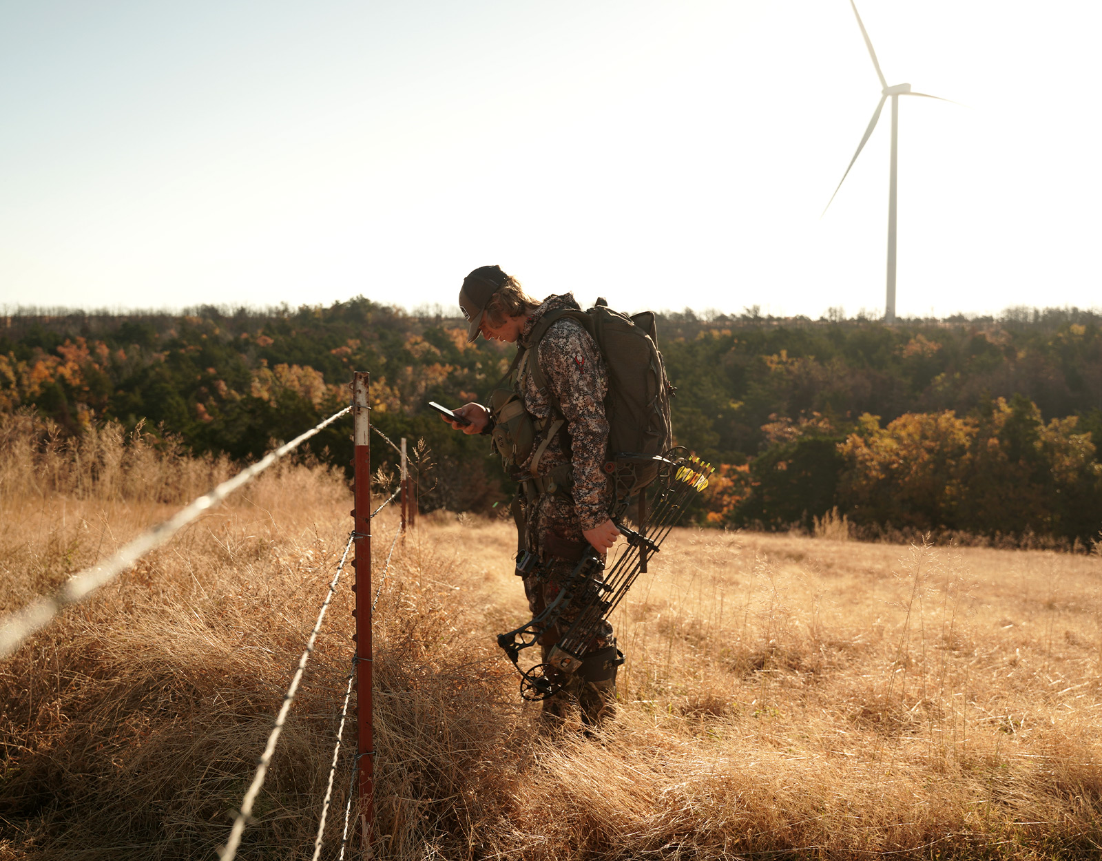 A hunter looking for property lines on a phone. 