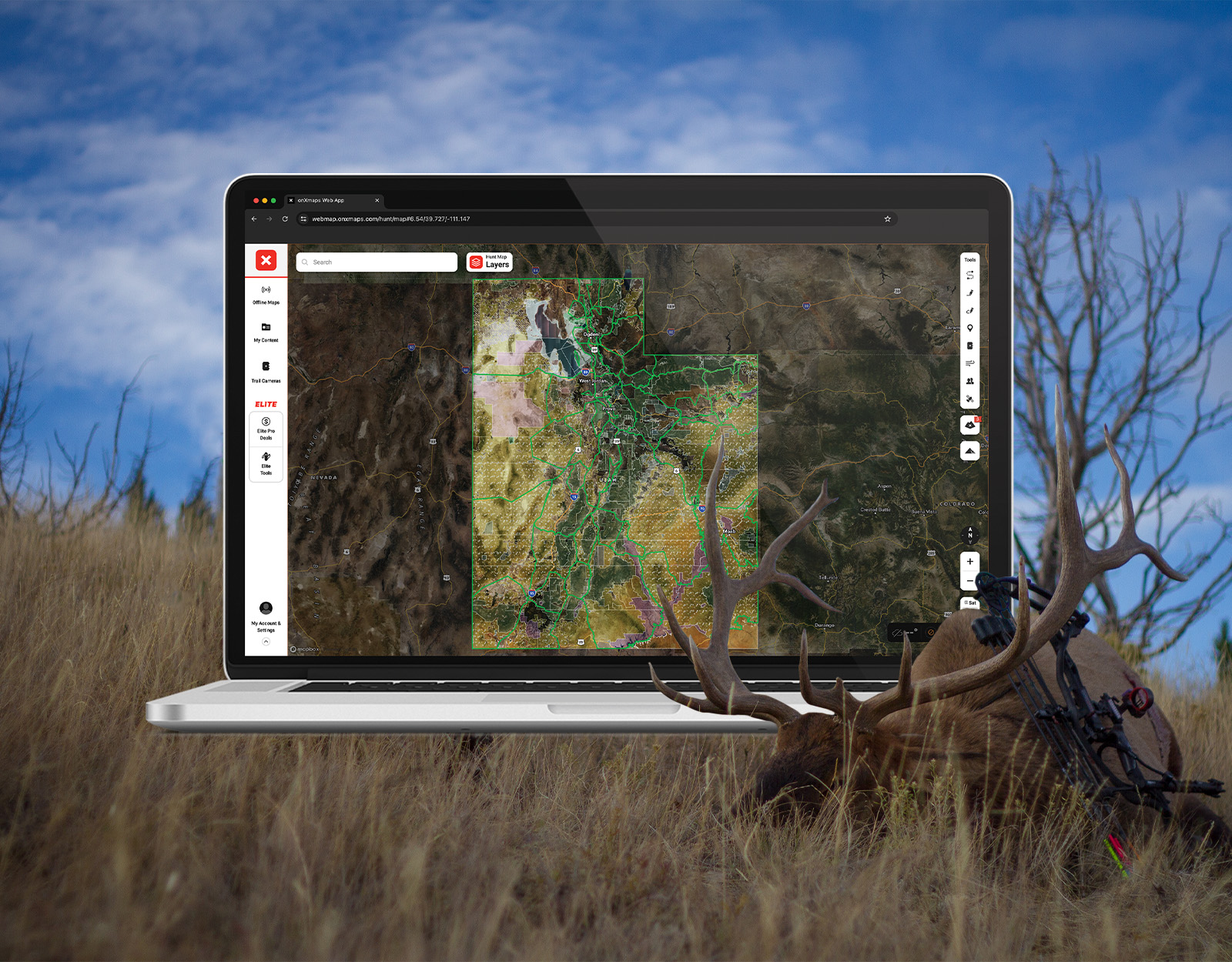 Screenshot of onX Hunt Web Map overlaying an image of a downed bull elk. 
