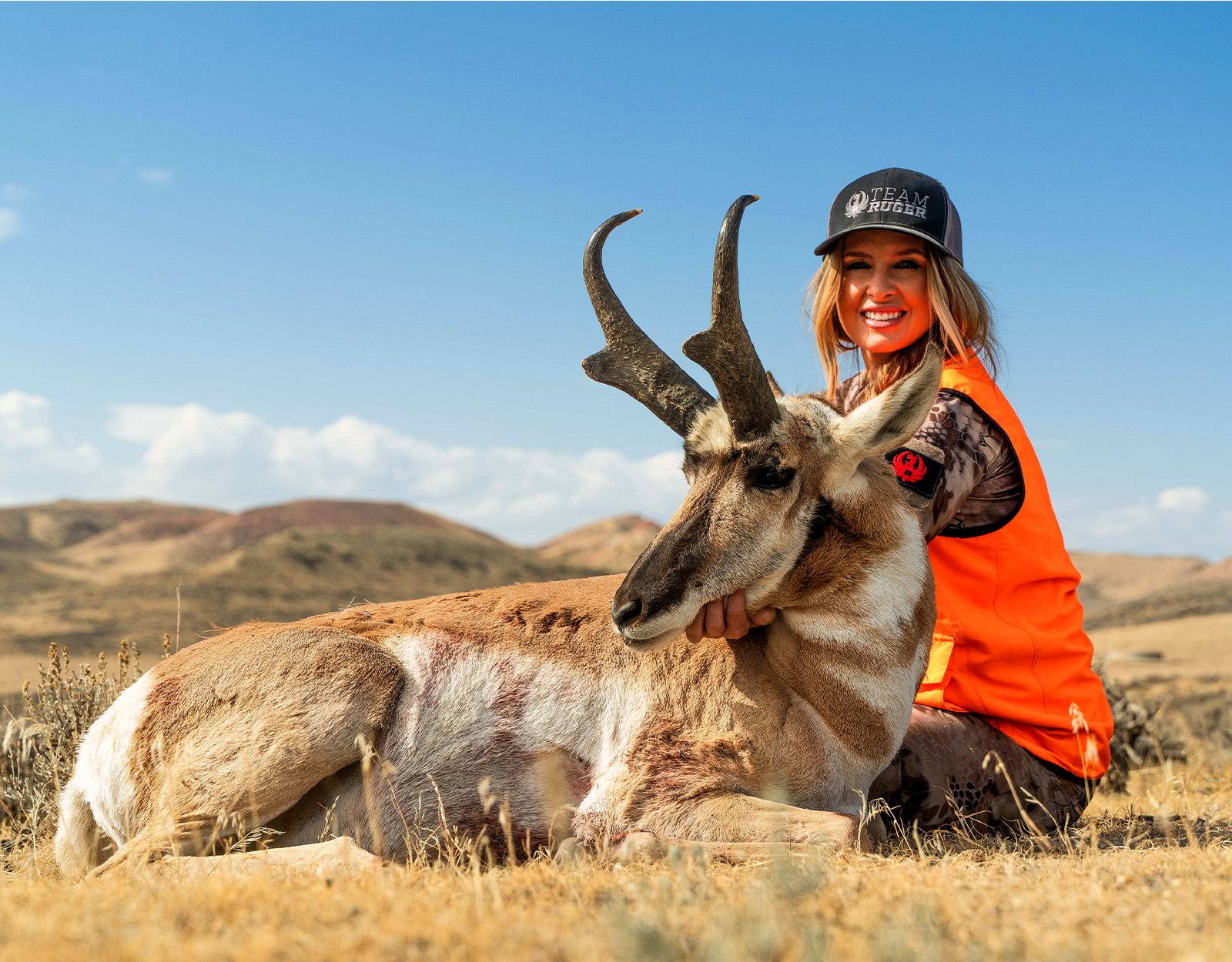 A female hunter with an antelope she harvested 