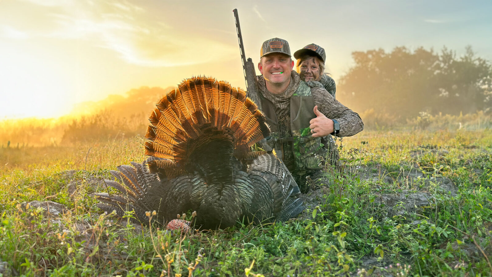 A father and son with a havested turkey
