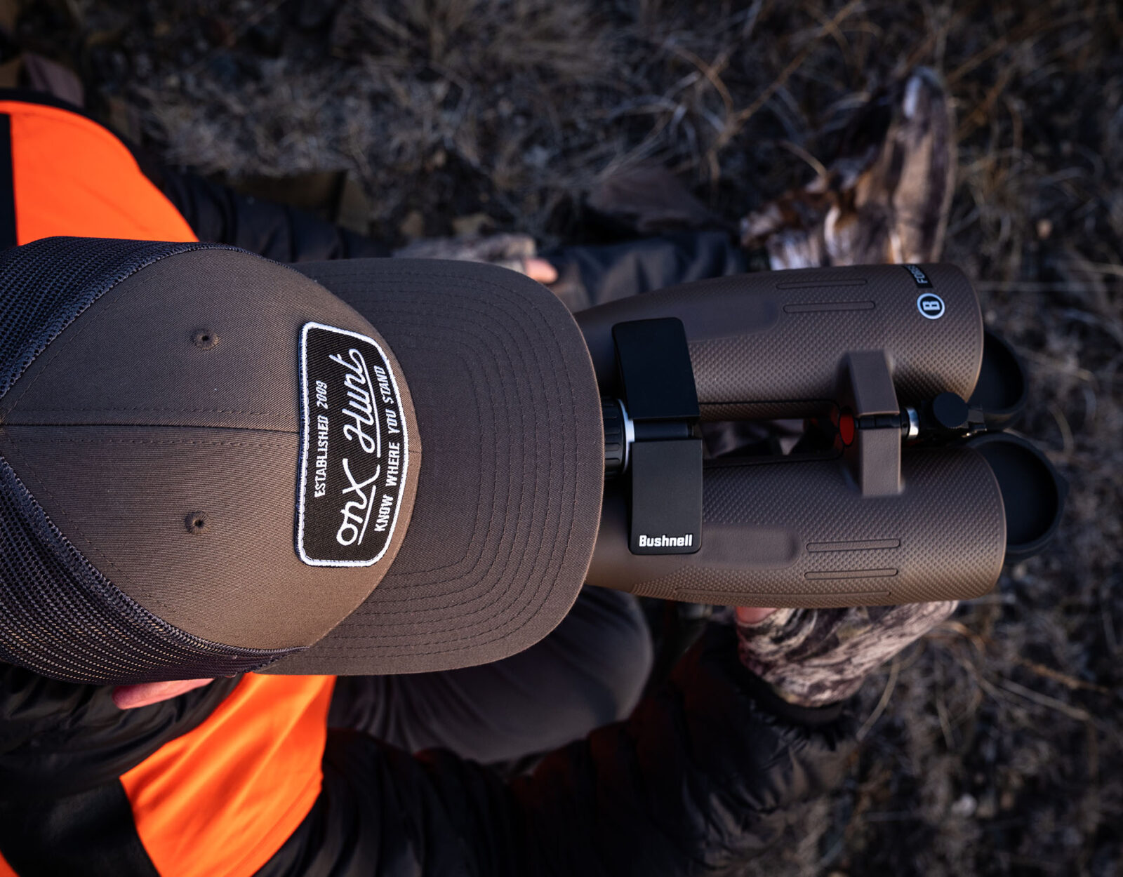 Bird's eye view of a hunter using Bushnell binoculars.