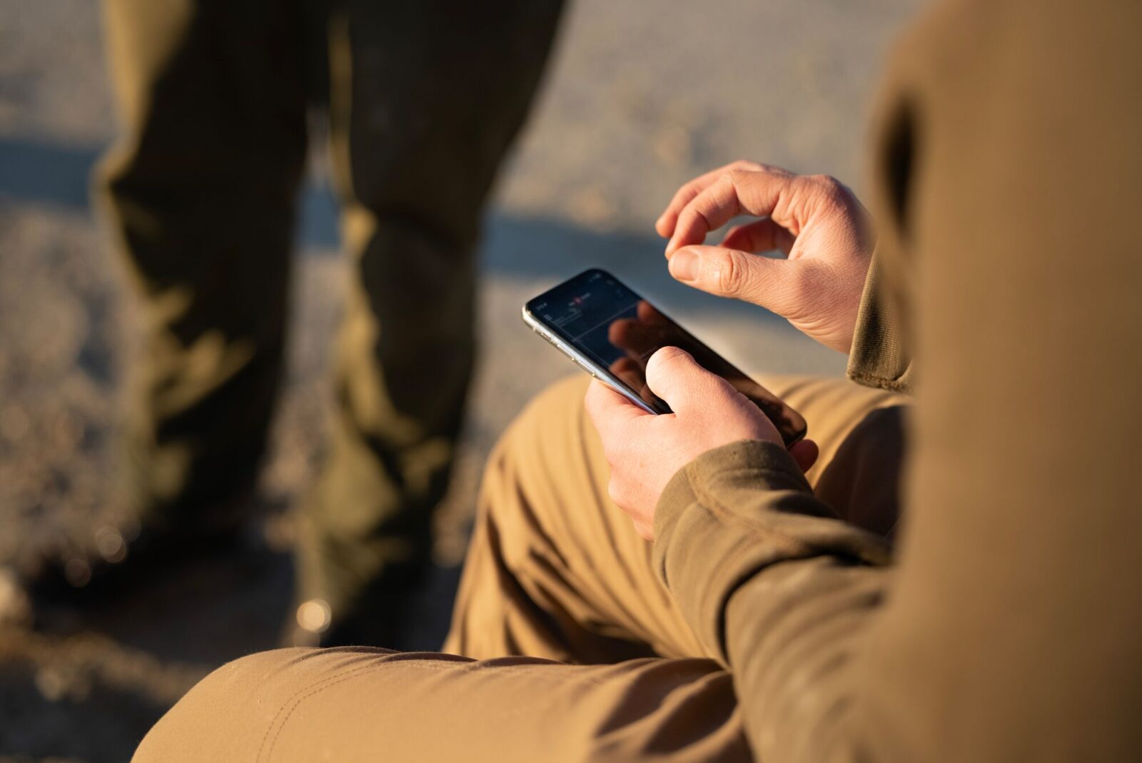 A hunter uses the Hunt App in the field.