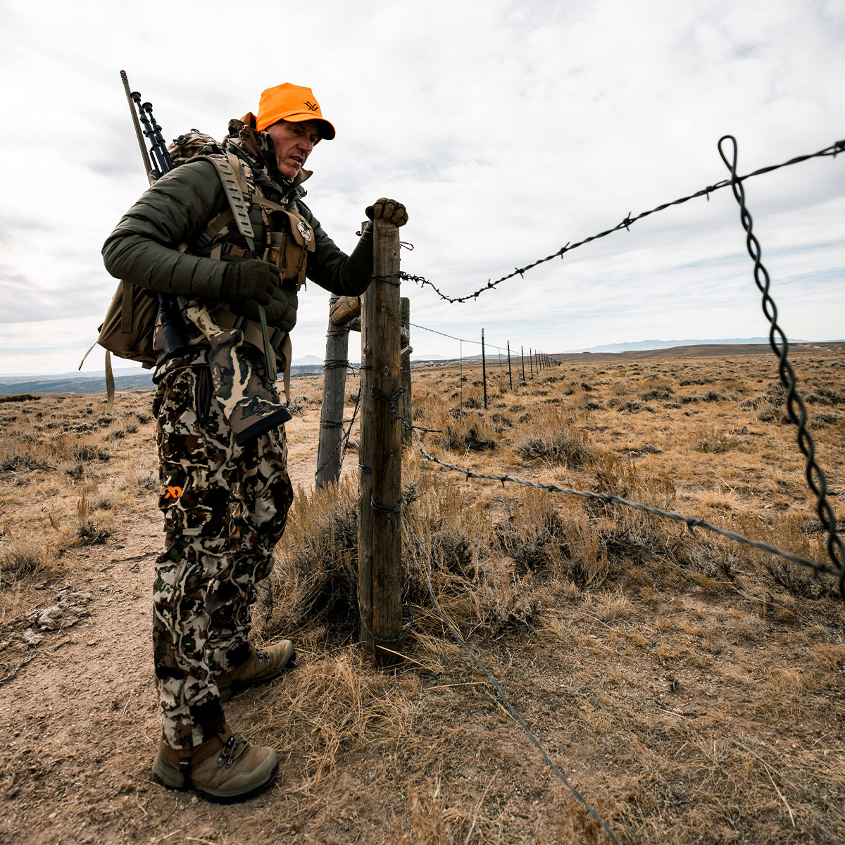Hunter in camo looking at private land boundaries