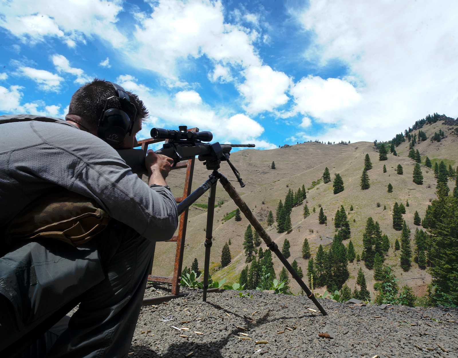 A man prepares for a shot at a long-range shooting range.