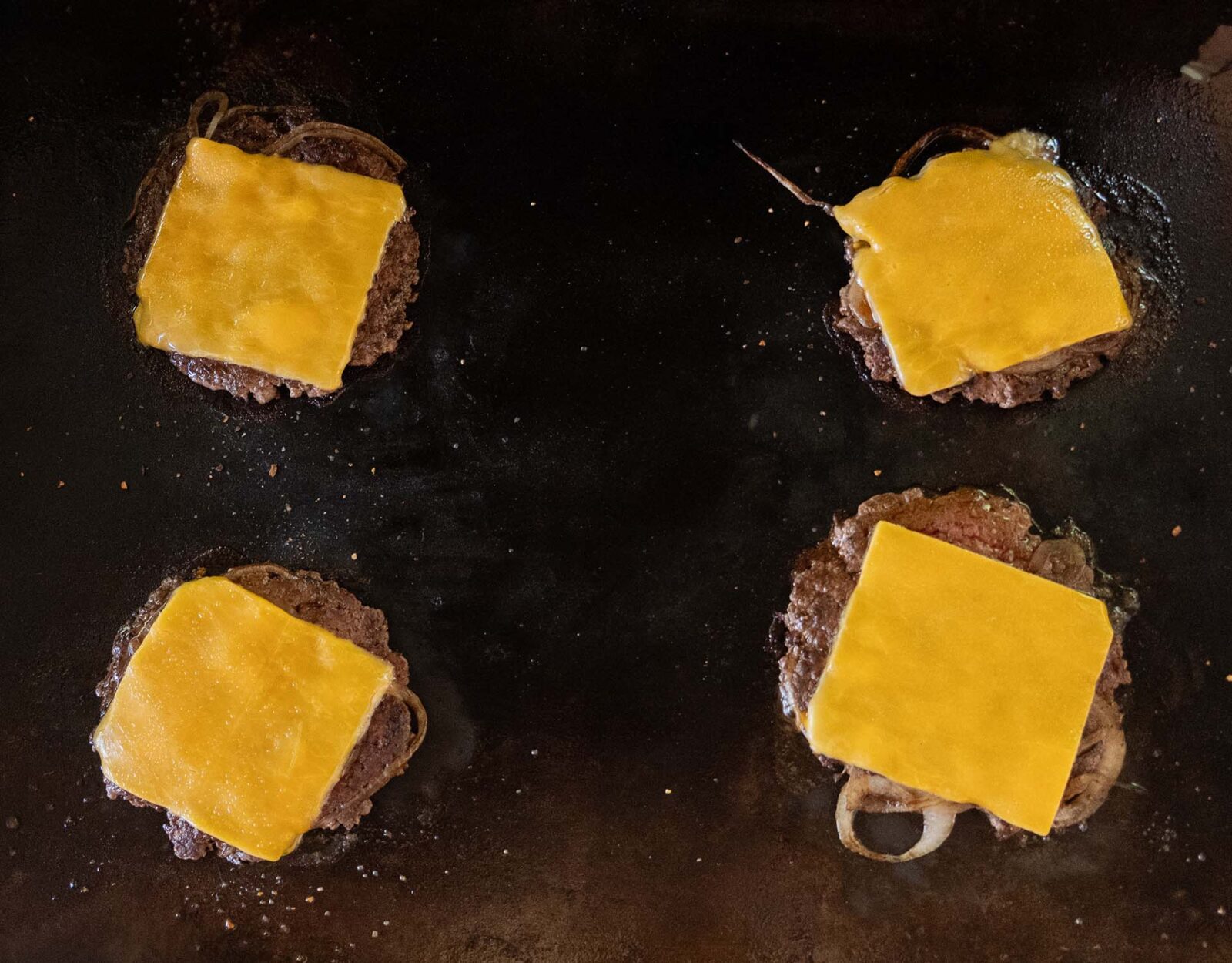 Grilled venison burgers with cheese.