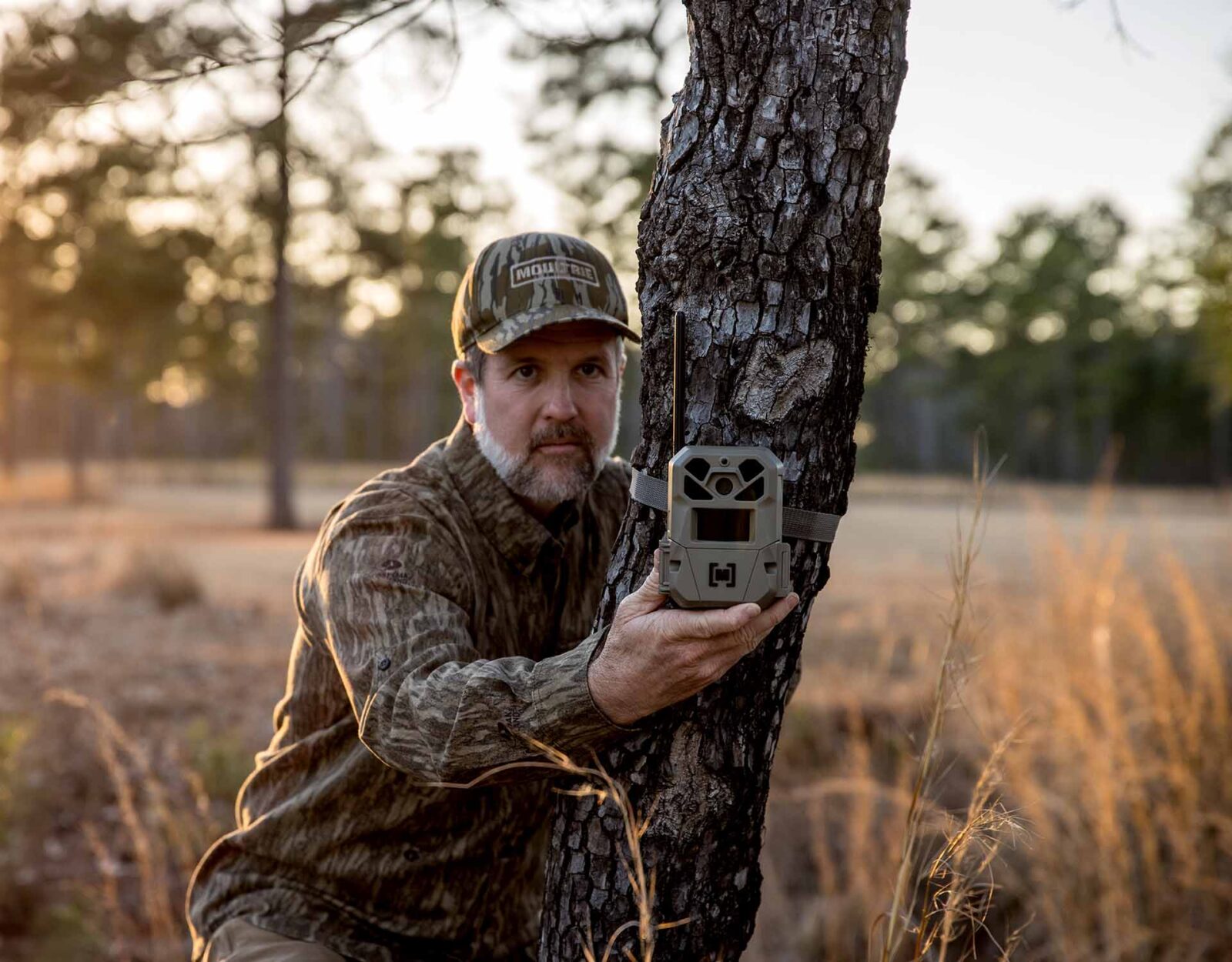 A hunter places a trail c