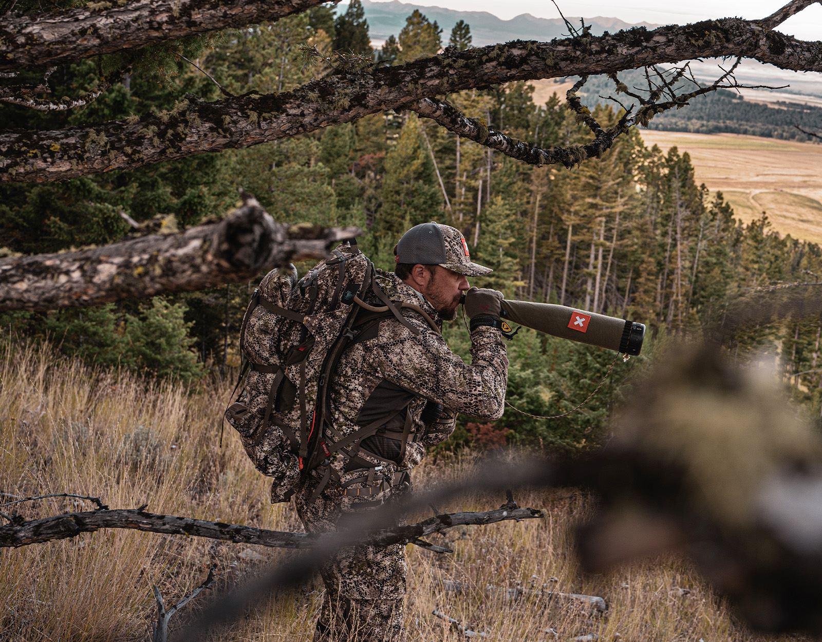 A man uses a bugle tube. 