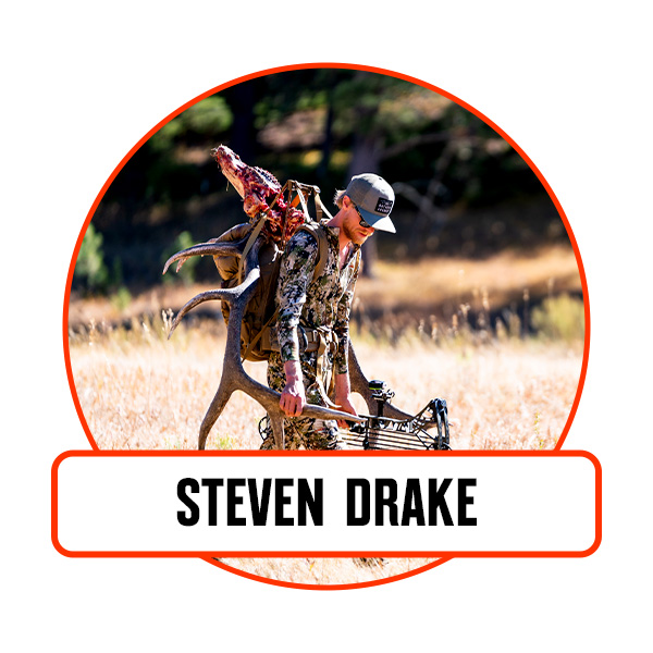 A man packs out an elk.