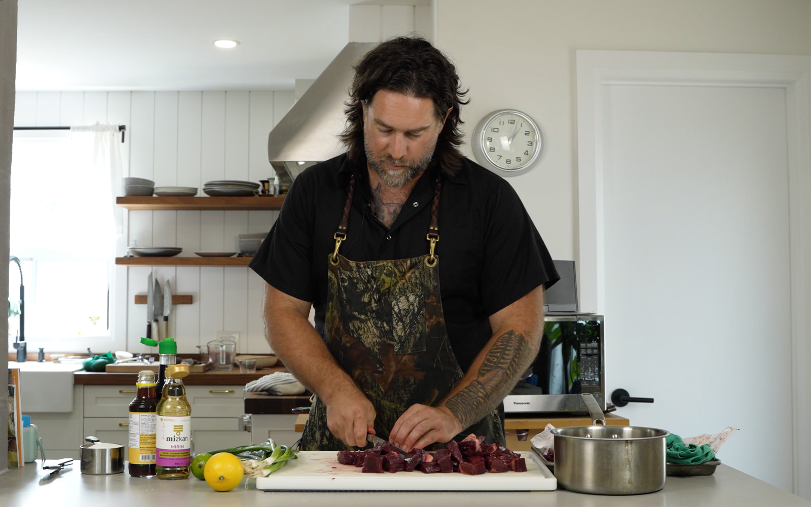 Chef Michael Hunter prepares a deer heart recipe in his kitchen.