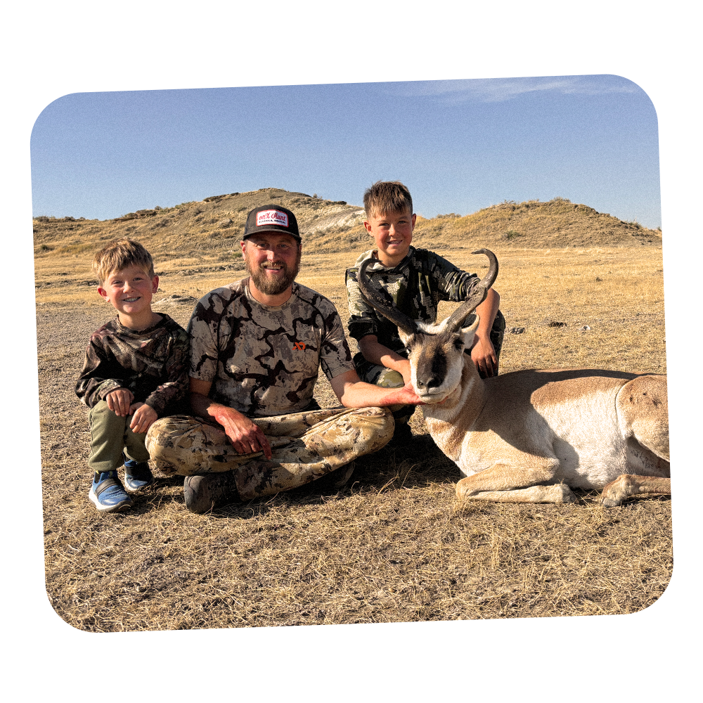 A family poses with their antelope harvest.