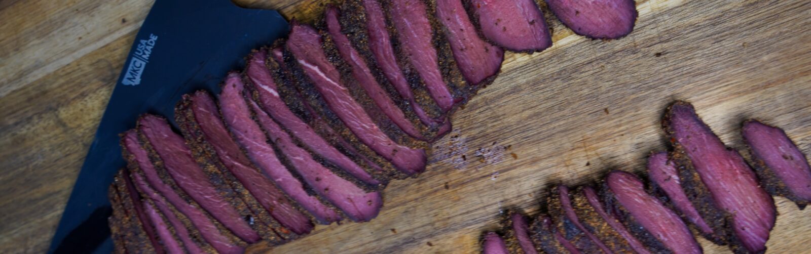 Goose pastrami on a carving board.