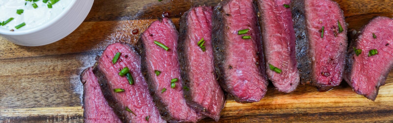 Sous vide elk on a carving board.