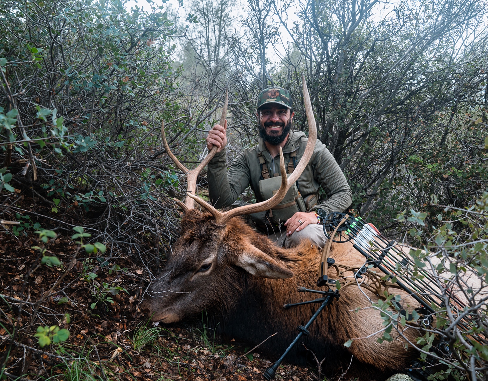 A grip and grin of a man and the elk he harvested.

