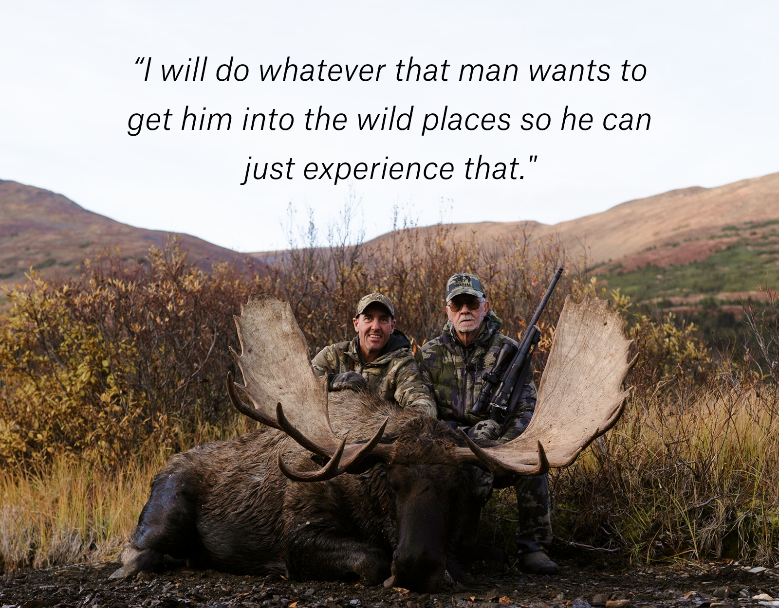 A father and son pose for a picture on a hunt.
