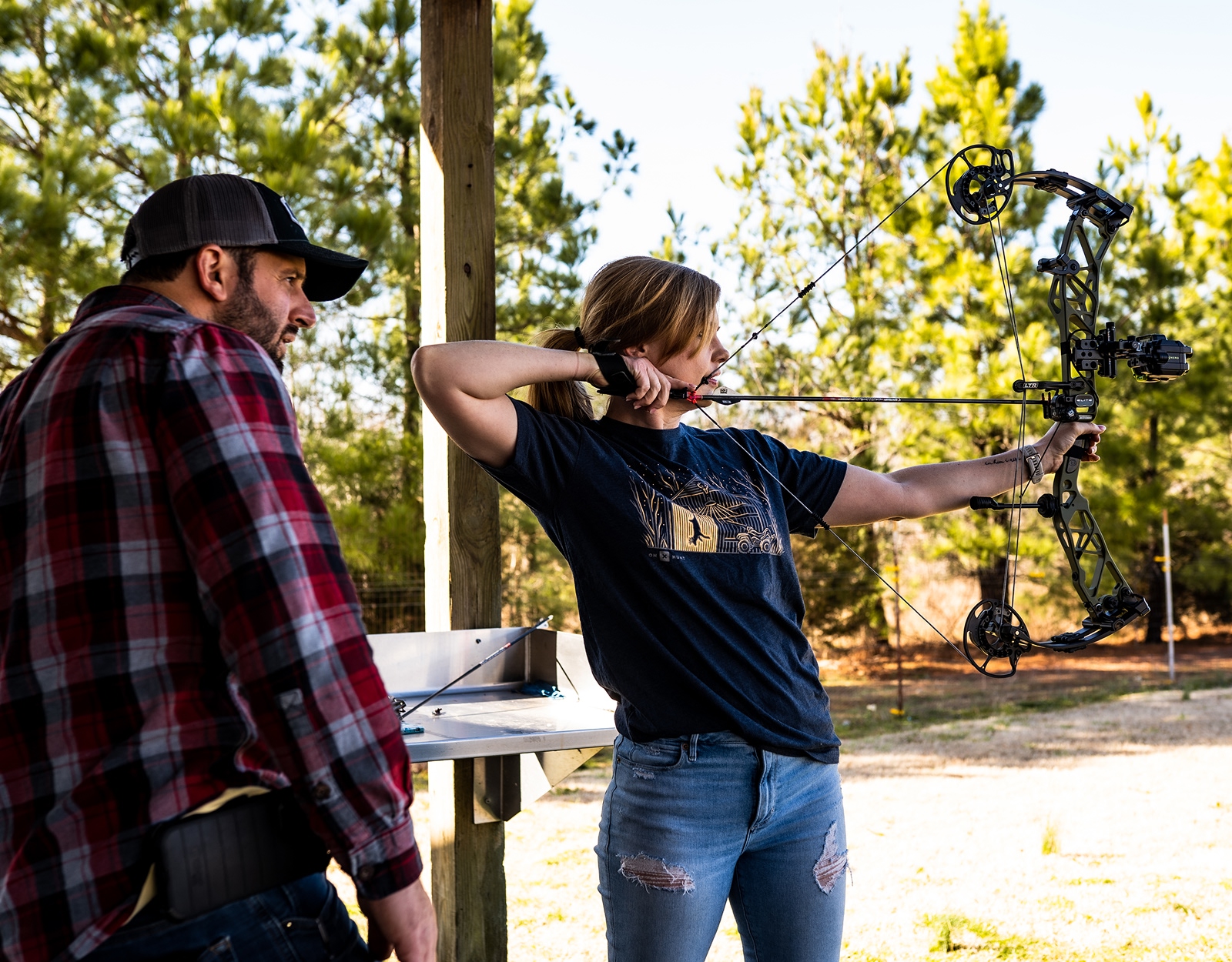 A person shooting a bow.