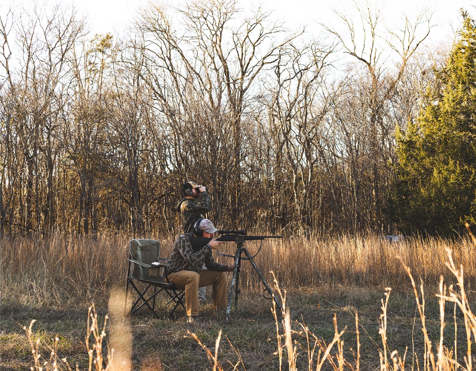 A hunter and camo in the field.