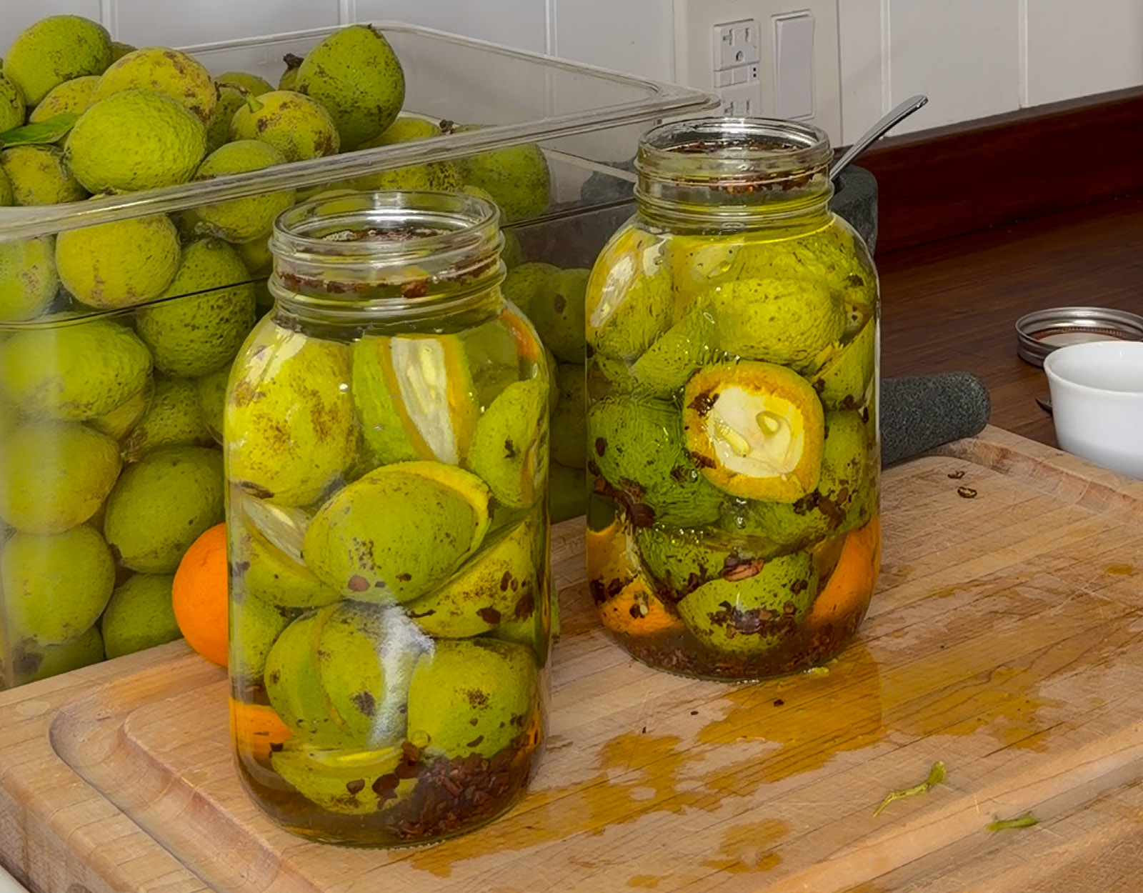 Green walnuts infusing alcohol.