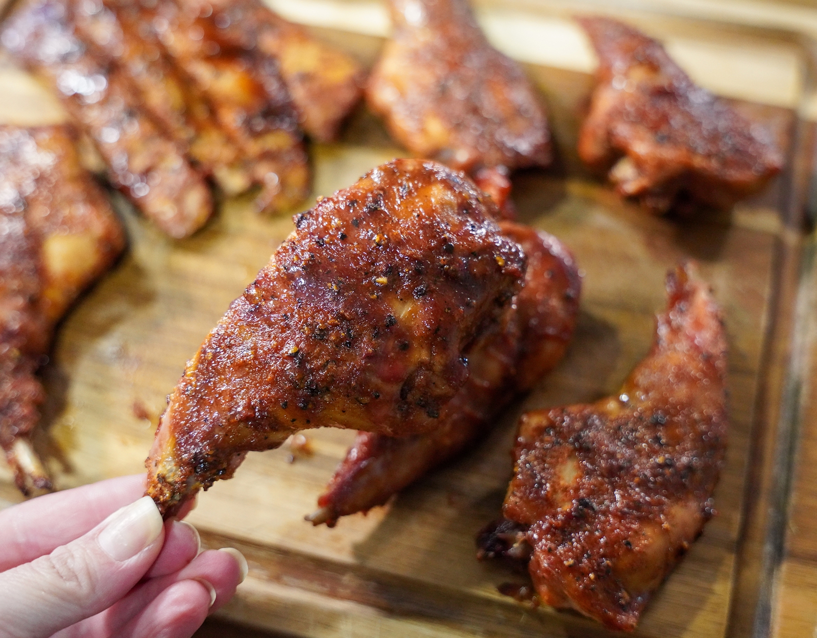 Grilled rabbit pieces on a cutting board