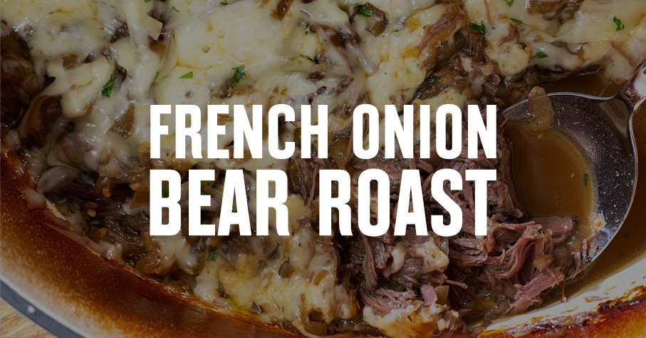 Bear roast plated on a bed of mashed potatoes.