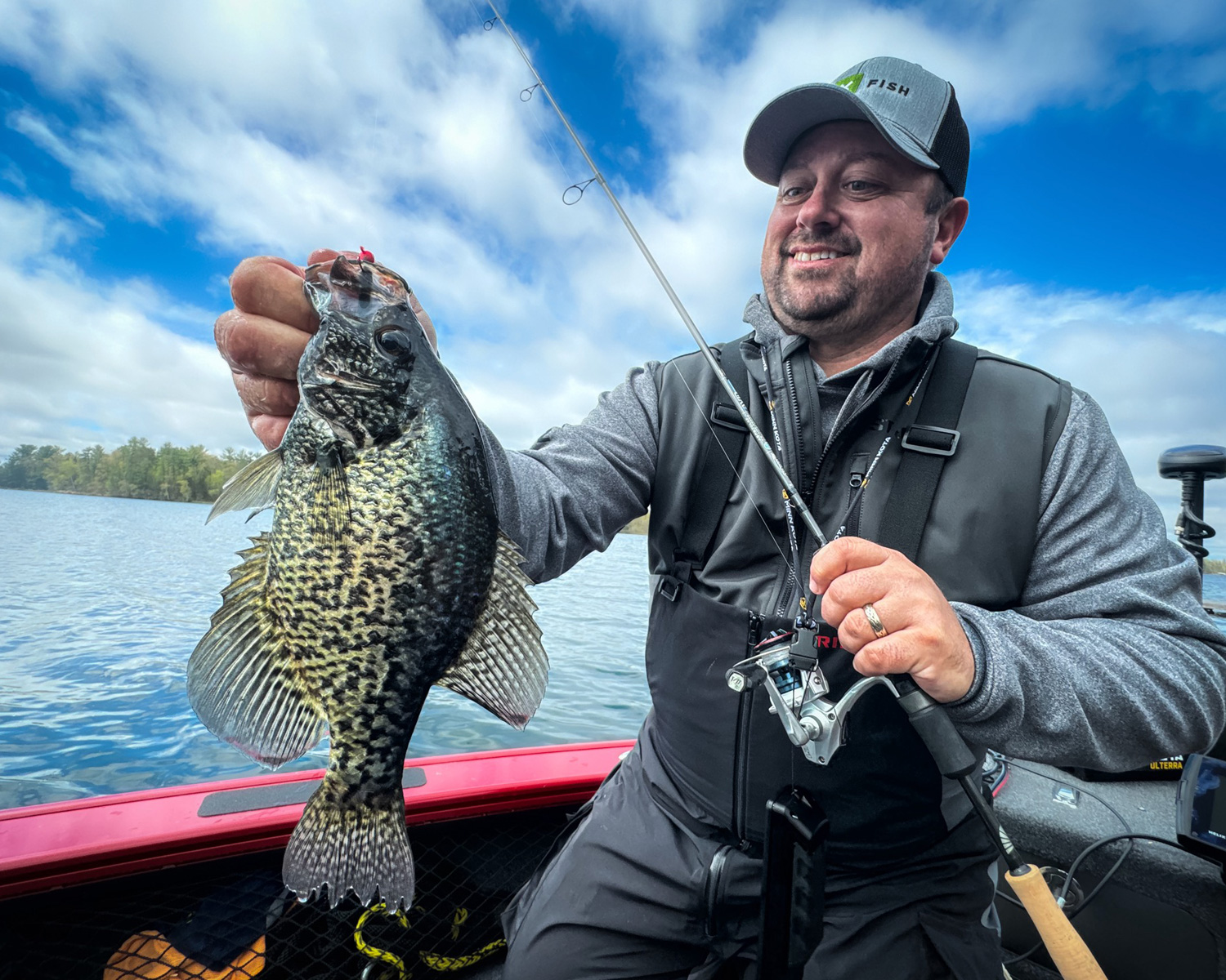 An angler holds a crappie they caught.