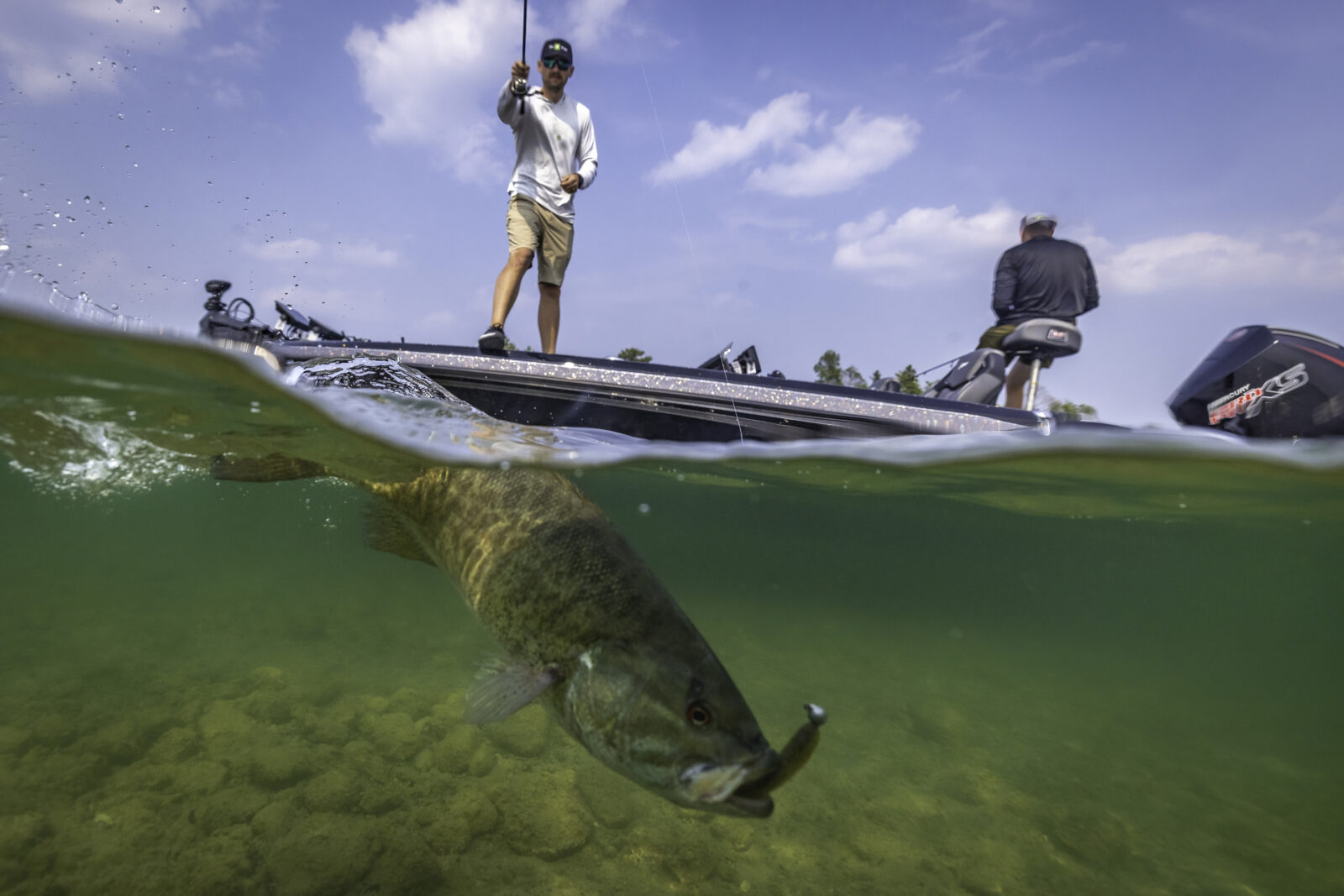 angler catching a bass