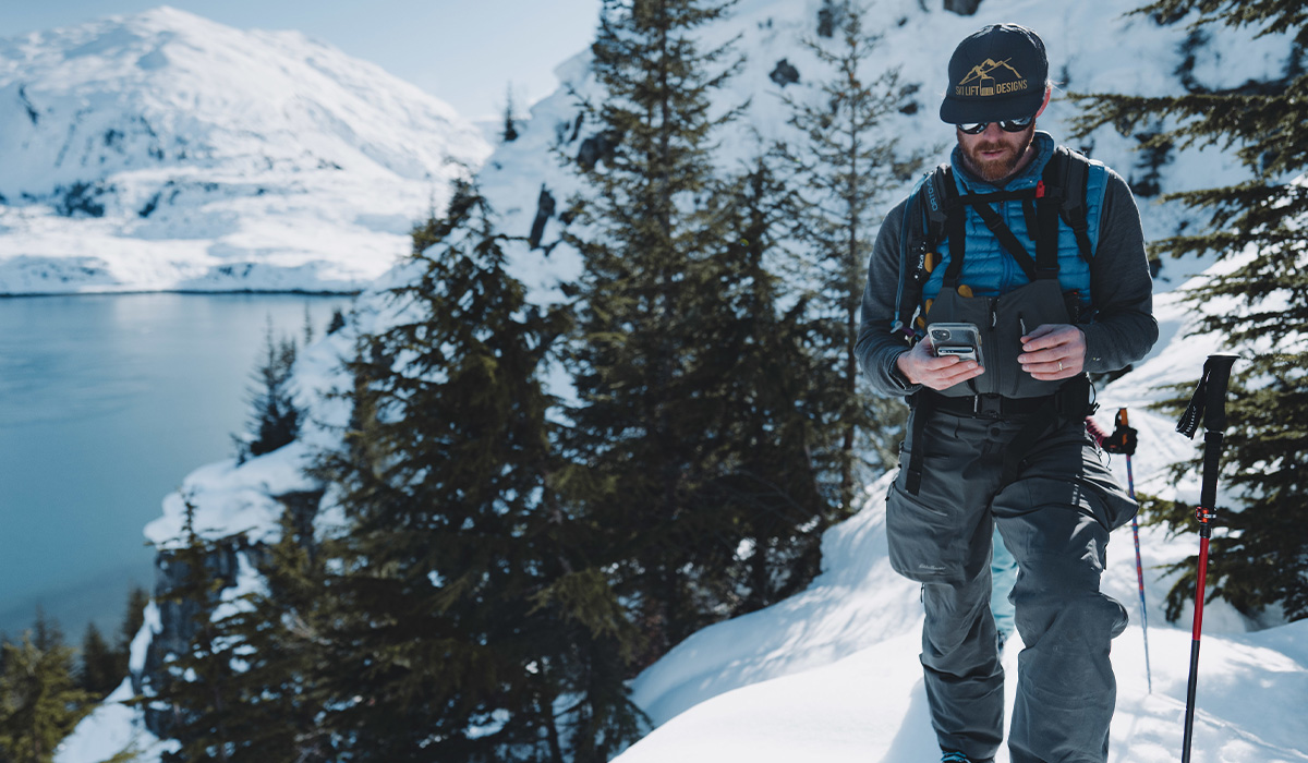 looking at onX Backcountry app while backcountry skiing