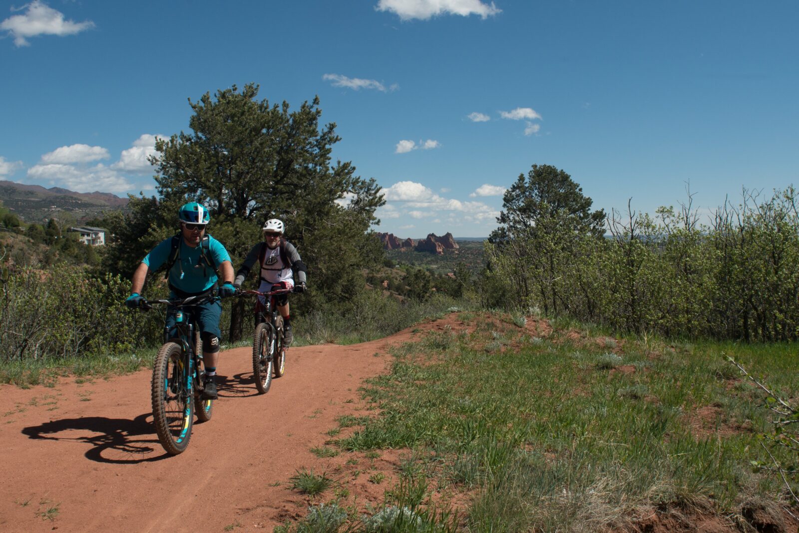 A man and women biking on a trail in the sand canyon 