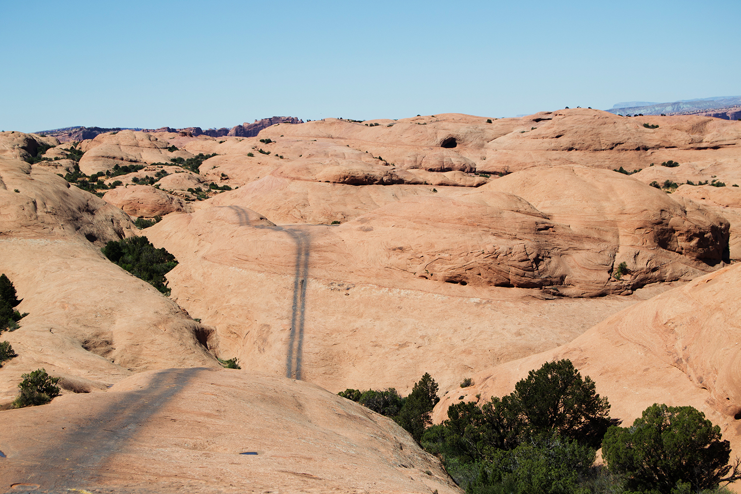 Trail in moab going through some rock