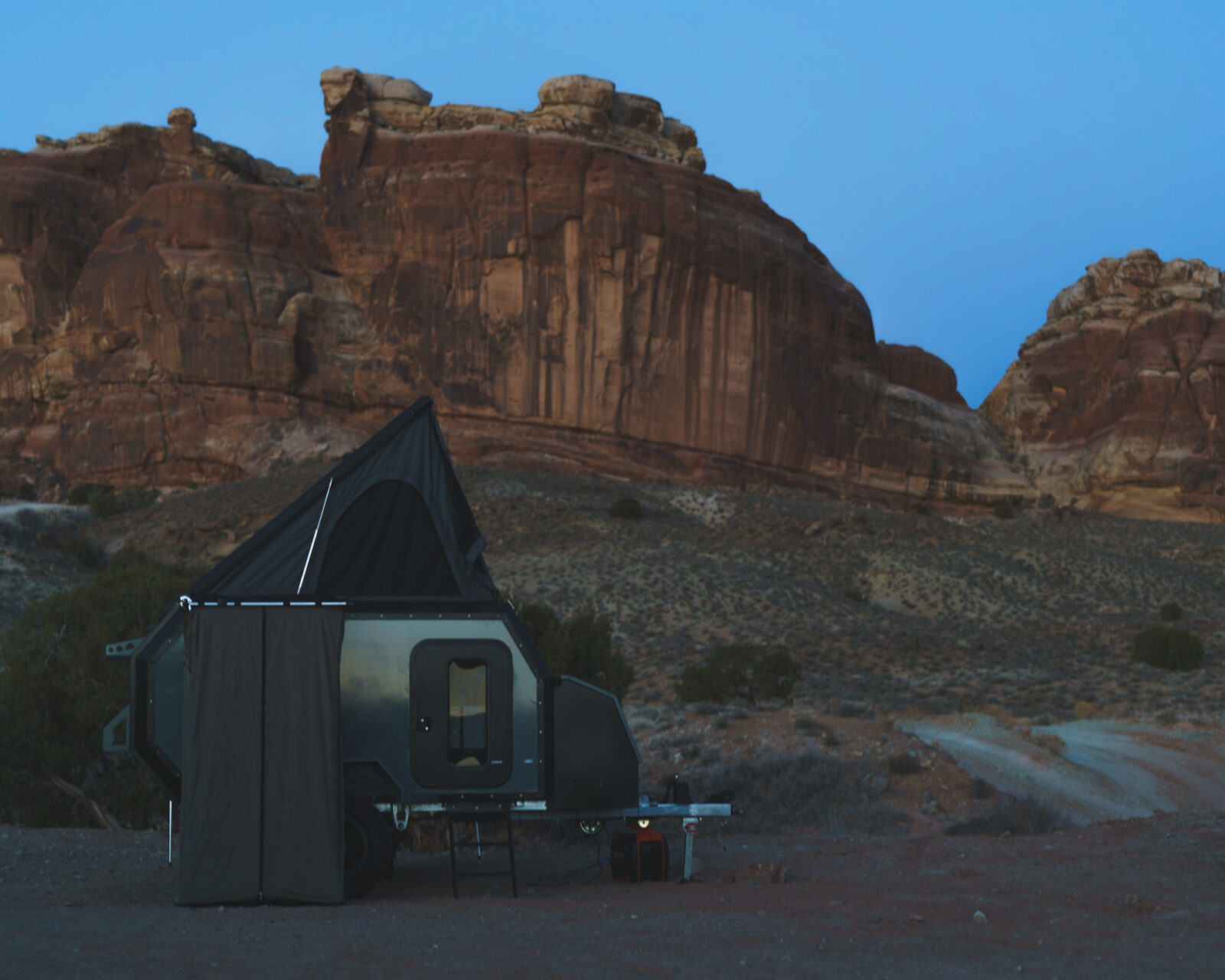off-road pop up camper in a desert terrain
