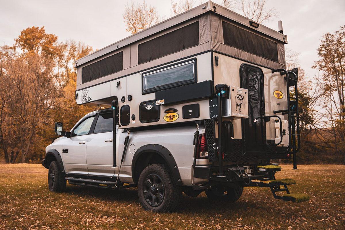 A truck with a camper on the back