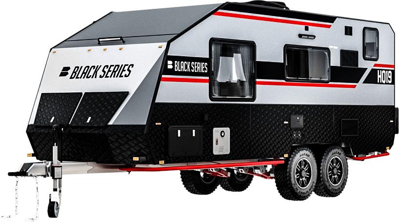 An off-road camper trailer with wheels and a black and white trailer